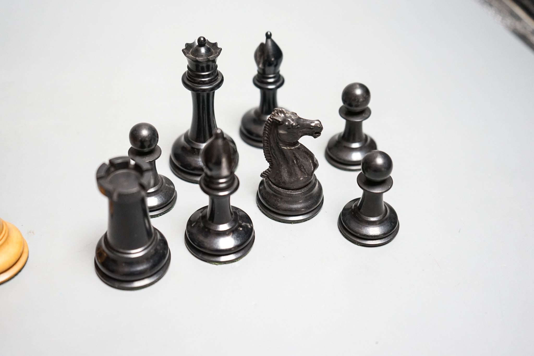 A boxed Jaques Staunton boxwood and ebony chess set, White king stamped Jaques London, 8.5cm high
